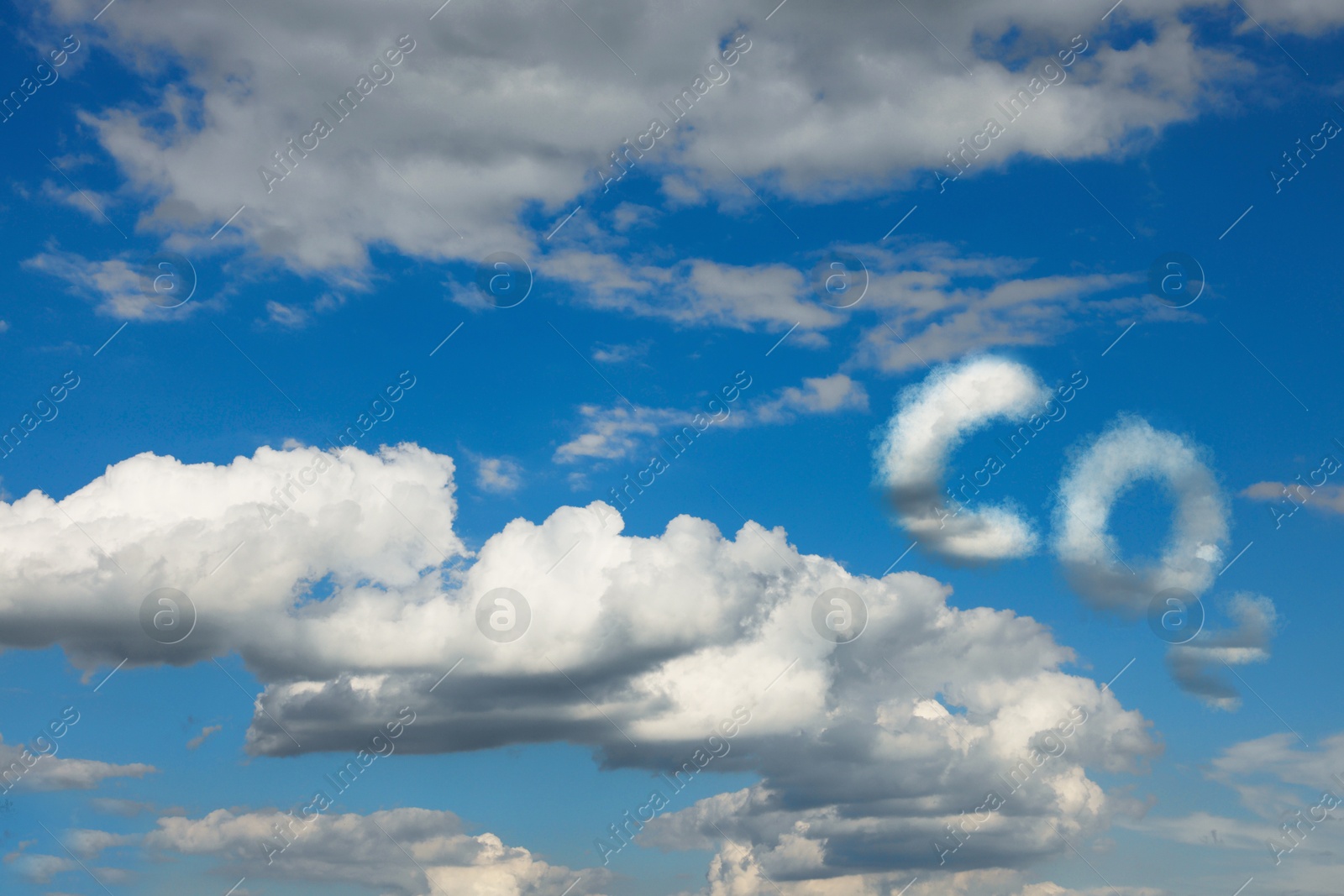 Image of Blue sky with CO2 chemical formula and clouds. Carbon dioxide emissions