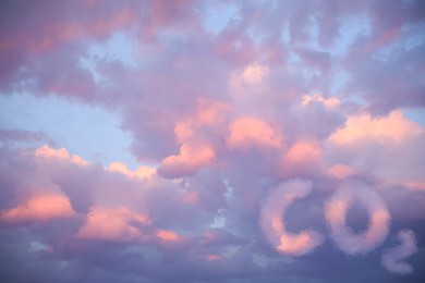 Image of Sunset sky with CO2 chemical formula and clouds. Carbon dioxide emissions