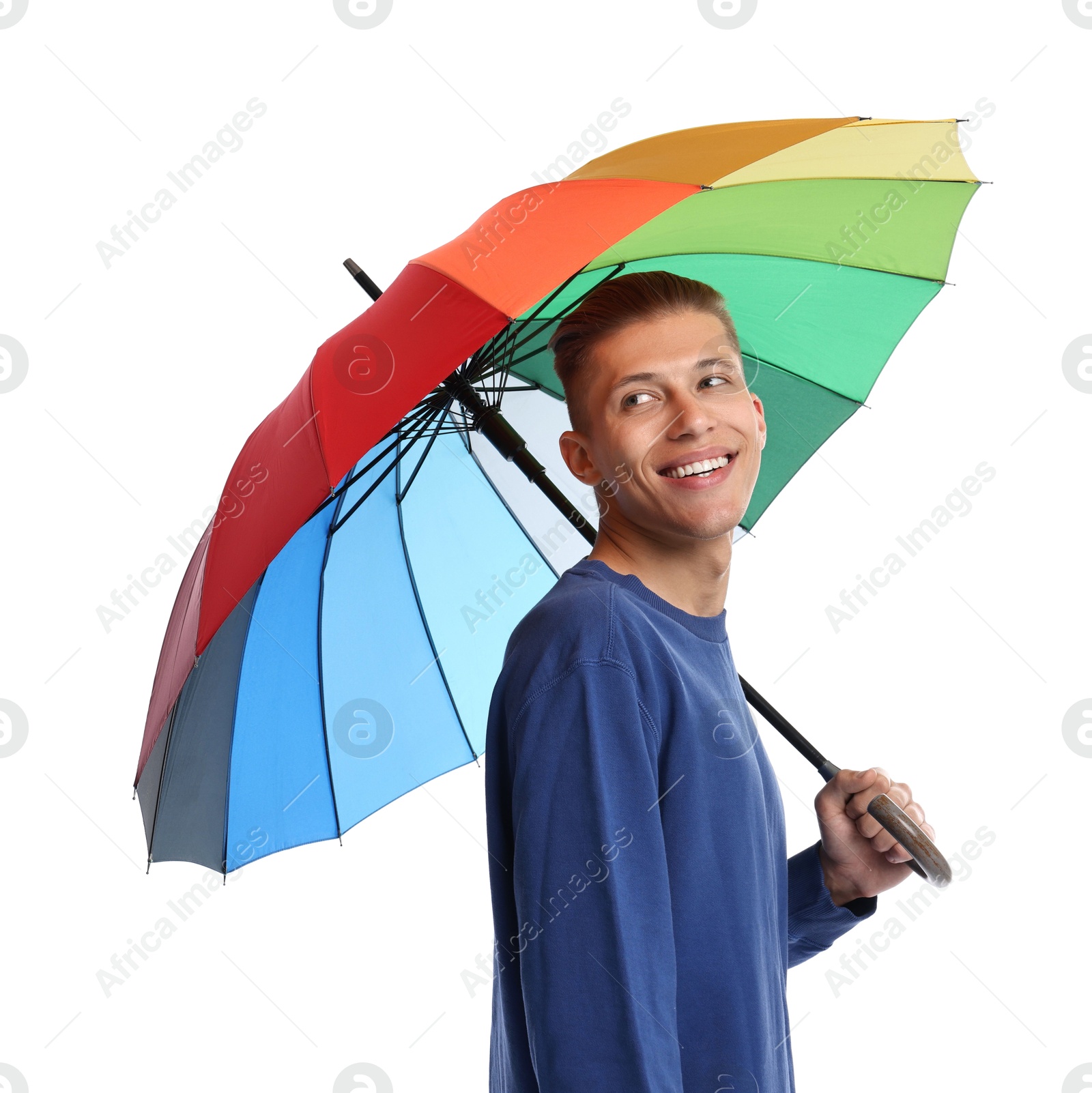 Photo of Young man with rainbow umbrella on white background