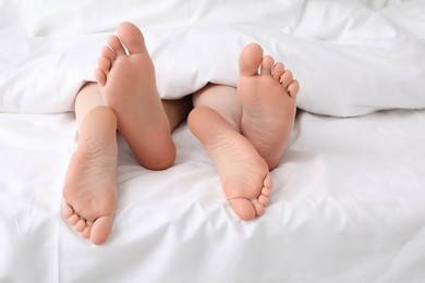 Photo of Lovely couple lying in bed, closeup view
