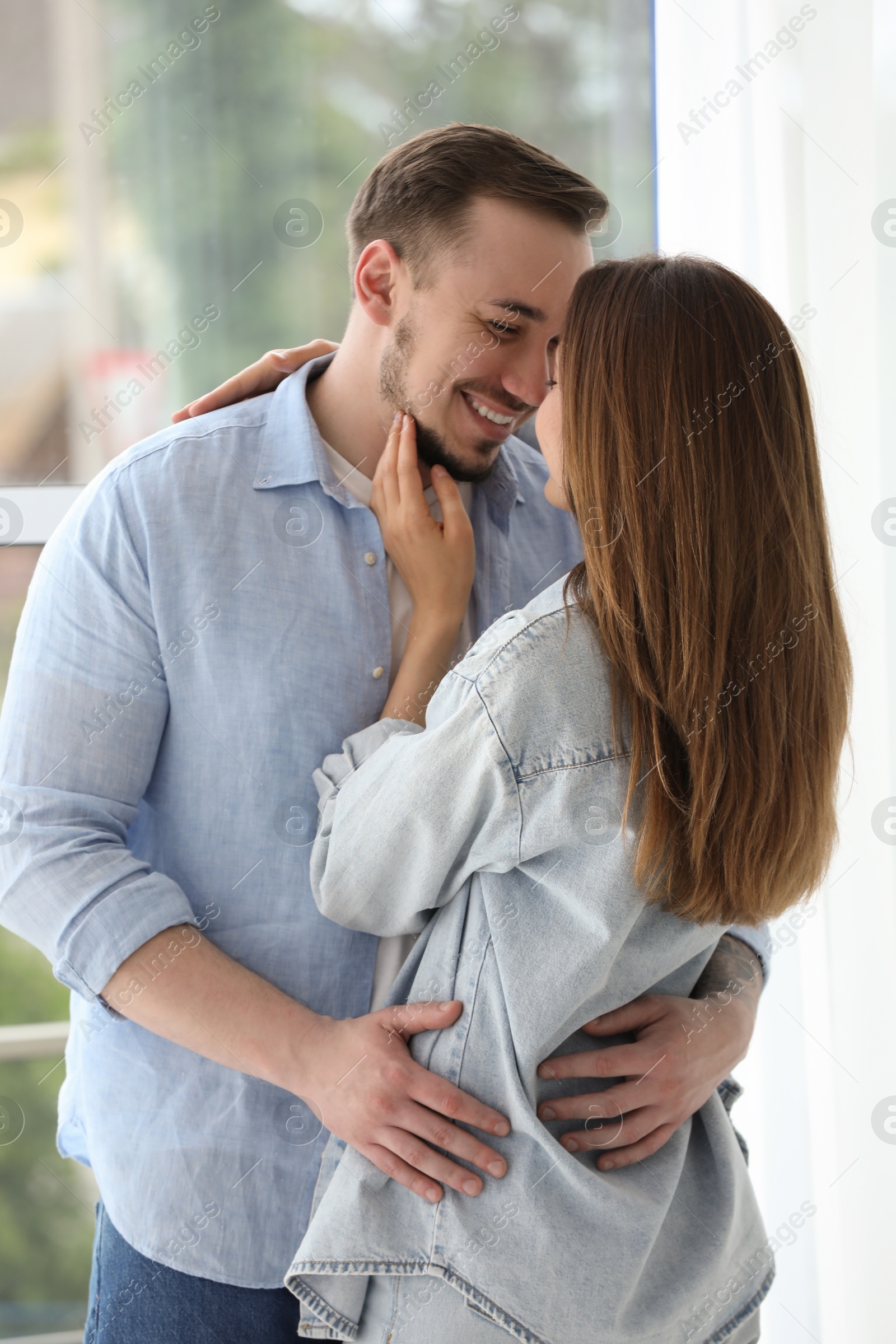 Photo of Happy couple hugging at home. Strong relationship