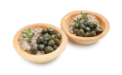 Photo of Delicious canapes with pate, capers and microgreens isolated on white