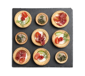 Delicious canapes with dry smoked sausages, jamon and pate isolated on white, top view