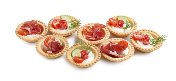 Delicious canapes with jamon, dry smoked sausages and vegetables isolated on white