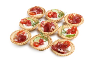 Delicious canapes with jamon, dry smoked sausages and vegetables isolated on white