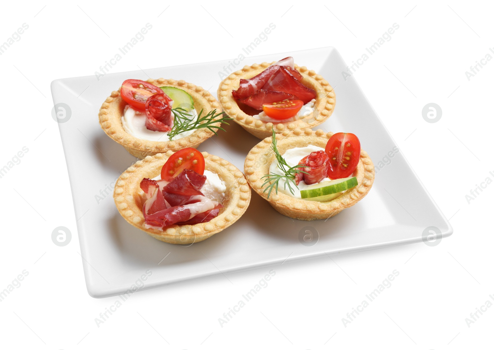 Photo of Delicious canapes with jamon, dry smoked sausages and vegetables isolated on white