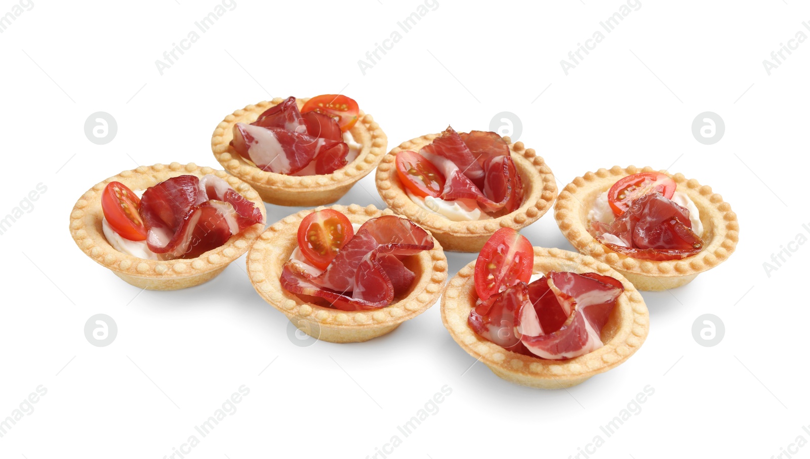 Photo of Delicious canapes with jamon, cream cheese and cherry tomatoes isolated on white