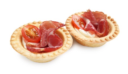 Photo of Delicious canapes with jamon, cream cheese and cherry tomatoes isolated on white