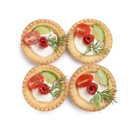 Delicious canapes with dry smoked sausages, cream cheese and vegetables isolated on white, top view