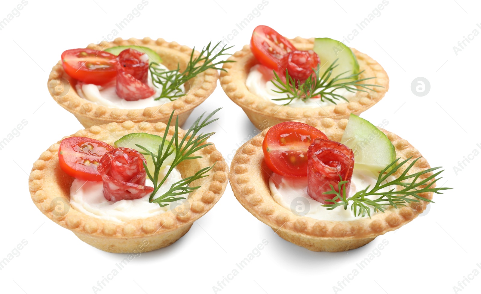 Photo of Delicious canapes with dry smoked sausages, cream cheese and vegetables isolated on white