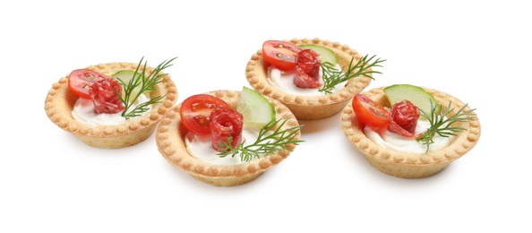 Photo of Delicious canapes with dry smoked sausages, cream cheese and vegetables isolated on white