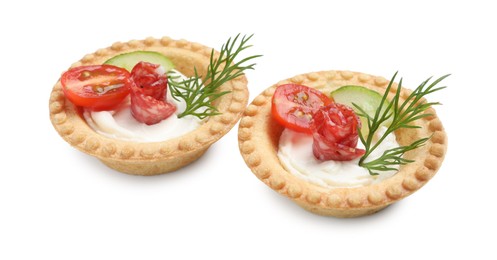 Photo of Delicious canapes with dry smoked sausages, cream cheese and vegetables isolated on white