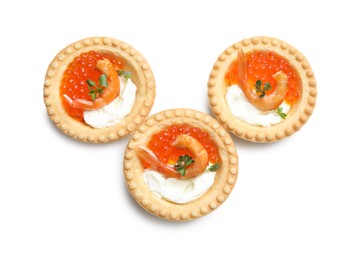 Photo of Delicious canapes with shrimps, red caviar and cream cheese isolated on white, top view