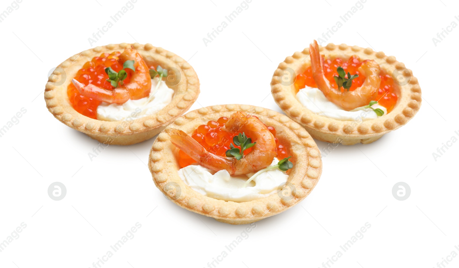 Photo of Delicious canapes with shrimps, red caviar and cream cheese isolated on white