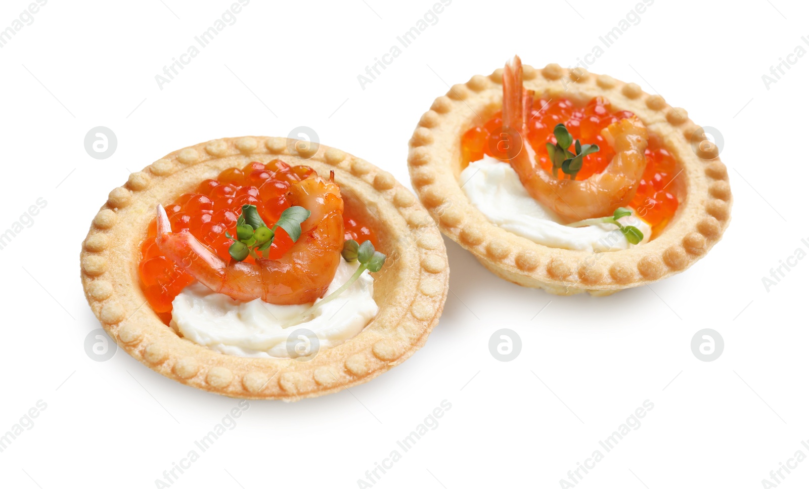 Photo of Delicious canapes with shrimps, red caviar and cream cheese isolated on white