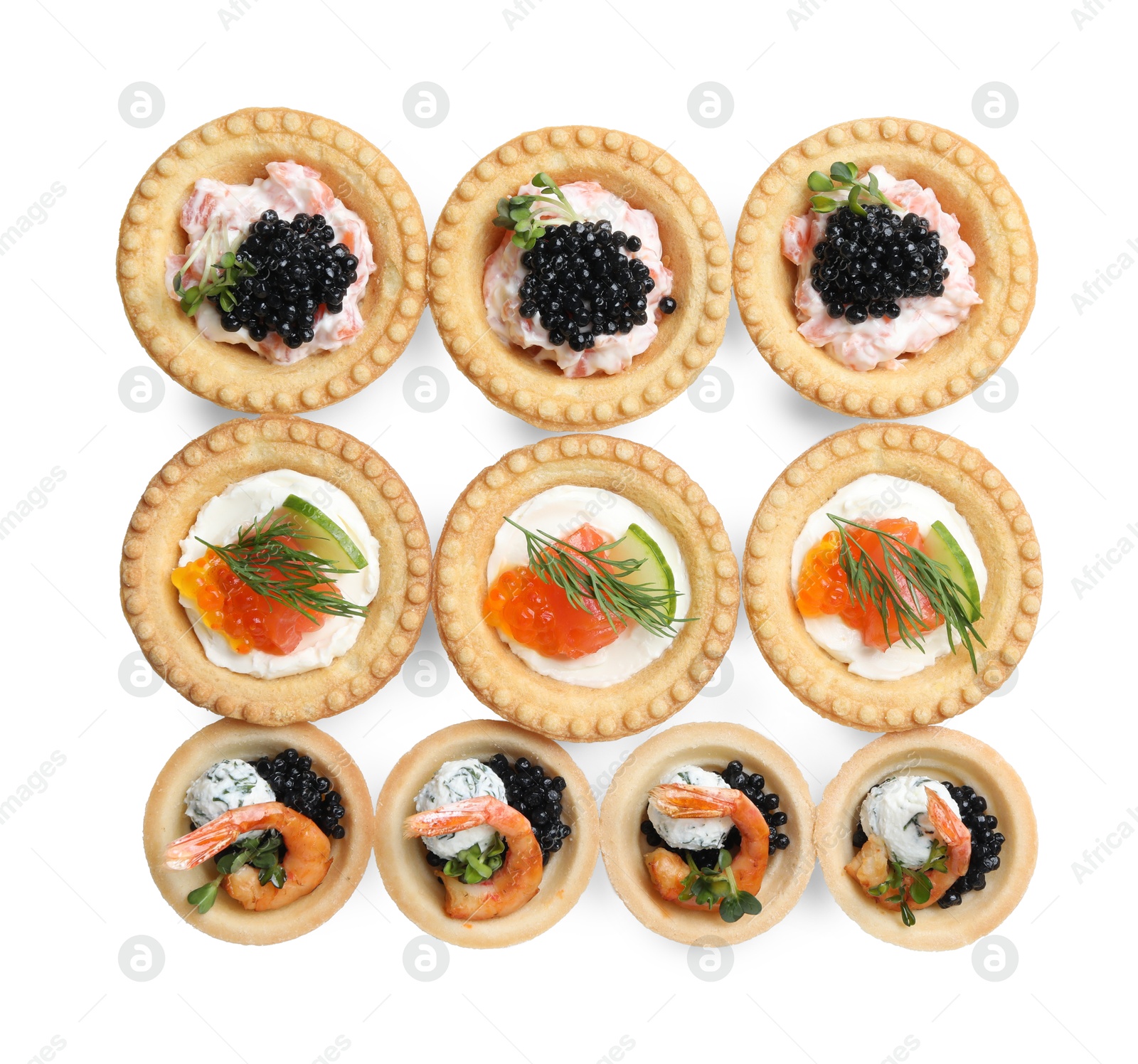 Photo of Delicious canapes with shrimps, salmon and caviar isolated on white, top view