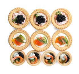 Delicious canapes with shrimps, salmon and caviar isolated on white, top view