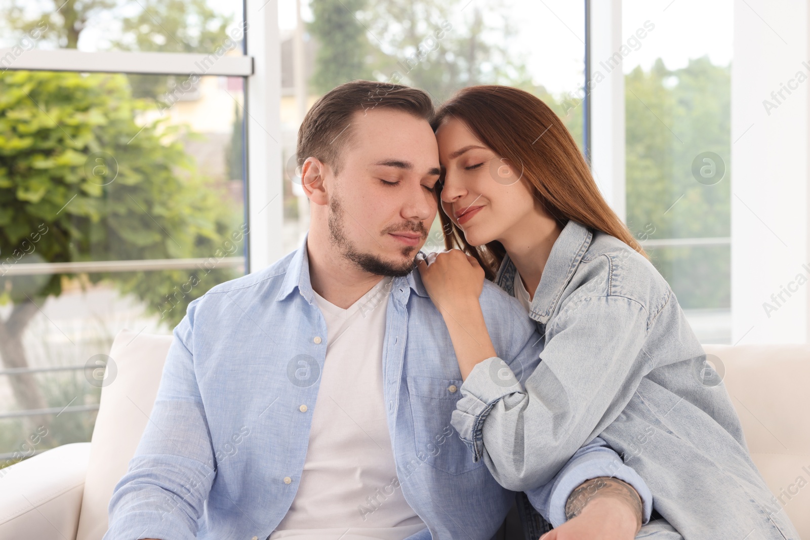 Photo of Cute couple enjoying each other at home