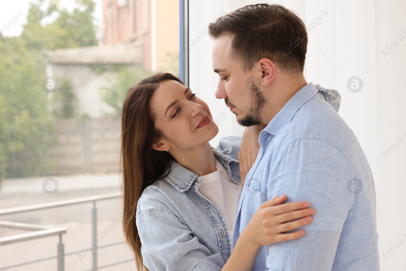 Photo of Cute couple enjoying each other at home