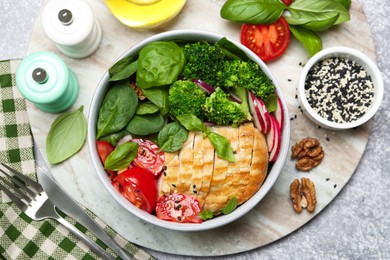 Photo of Healthy meal. Delicious chicken, vegetables and spinach served on table, flat lay