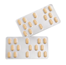 Antibiotic pills in blisters isolated on white, top view