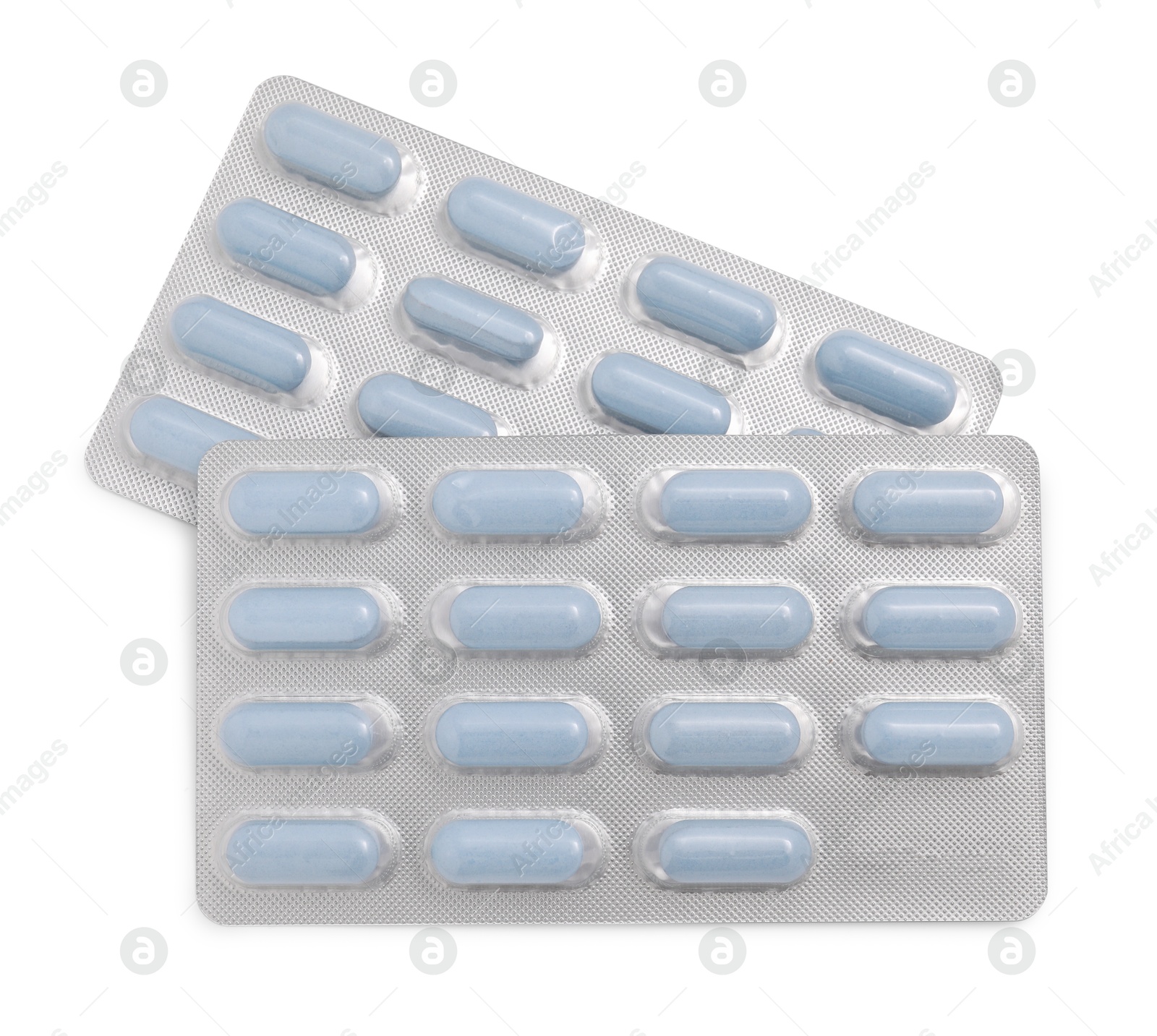 Photo of Antibiotic pills in blisters isolated on white, top view