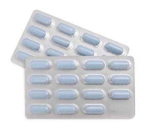 Antibiotic pills in blisters isolated on white, top view