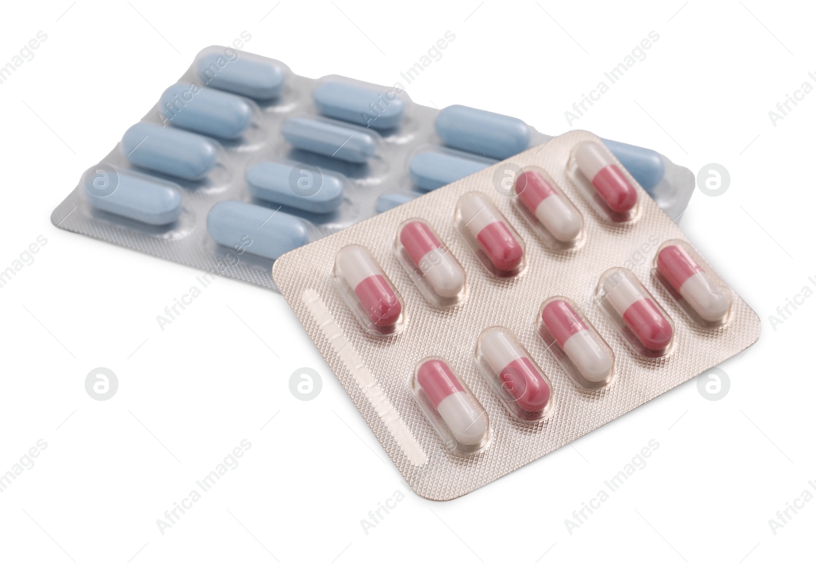 Photo of Different antibiotic pills in blisters isolated on white