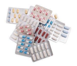 Different antibiotic pills isolated white, top view