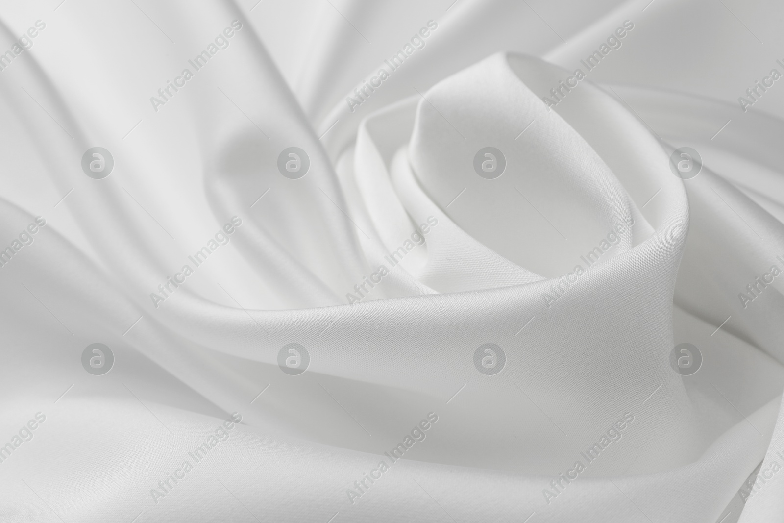 Photo of Texture of crumpled white silk fabric as background, closeup