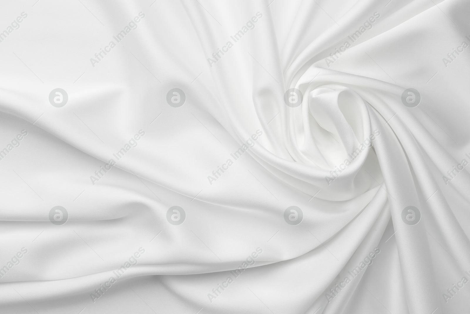 Photo of Texture of crumpled white silk fabric as background, top view