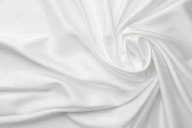 Texture of crumpled white silk fabric as background, top view