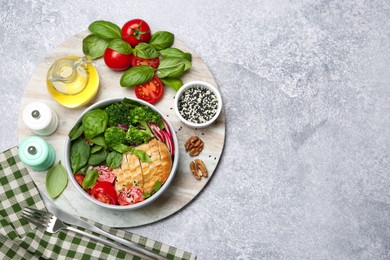 Photo of Healthy meal. Delicious chicken, vegetables and spinach served on table, flat lay. Space for text