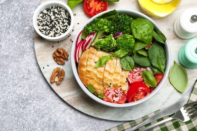 Photo of Healthy meal. Delicious chicken, vegetables and spinach served on table, flat lay