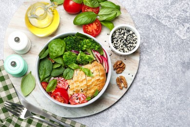 Photo of Healthy meal. Delicious chicken, vegetables and spinach served on table, flat lay. Space for text