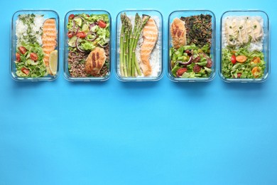 Photo of Healthy food. Different meals in glass containers on light blue background, flat lay. Space for text