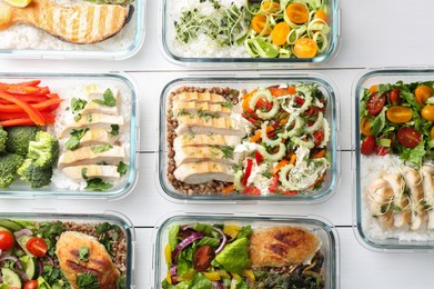 Healthy meal. Containers with different products on white wooden table, flat lay