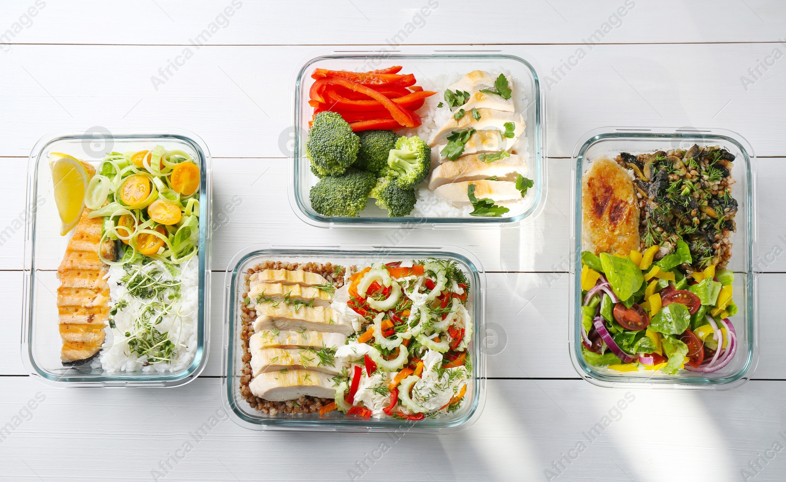 Photo of Healthy meal. Containers with different products on white wooden table, flat lay