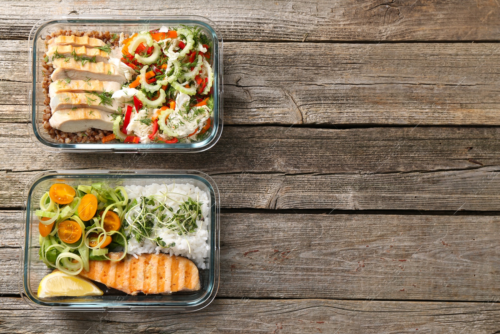 Photo of Healthy meal. Containers with different products on wooden table, flat lay. Space for text