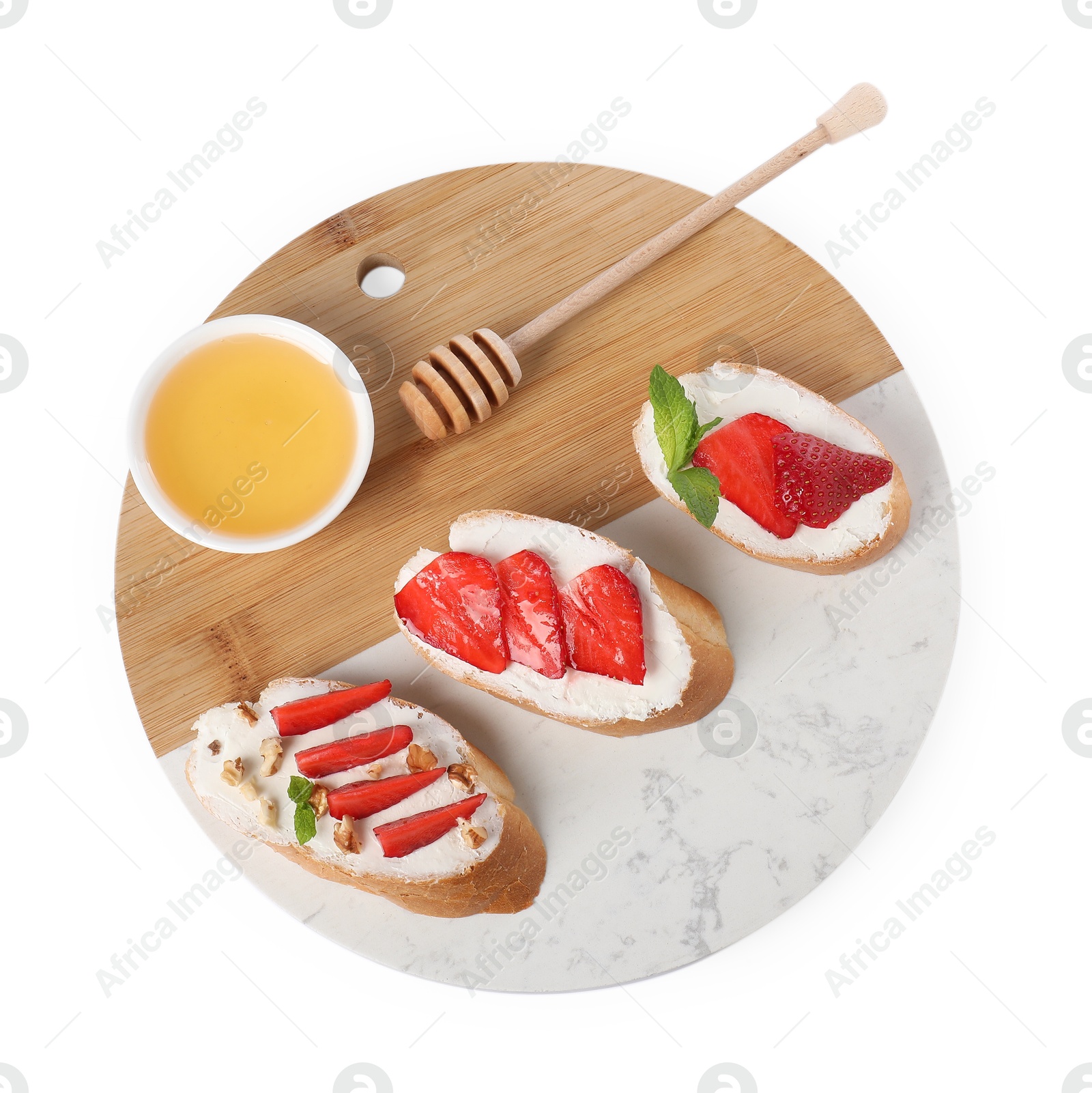 Photo of Delicious bruschetta with ricotta cheese, mint, walnuts, strawberries and honey isolated on white, top view