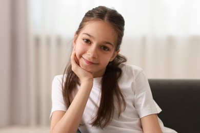 Portrait of beautiful little girl indoors. Cute child