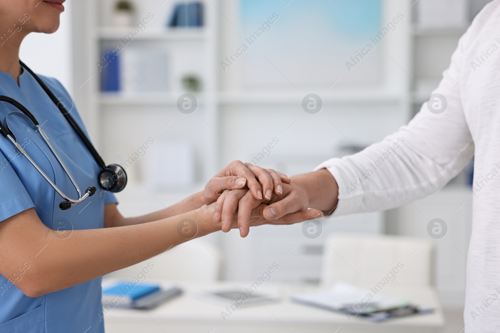 Photo of Professional doctor working with patient in hospital, closeup