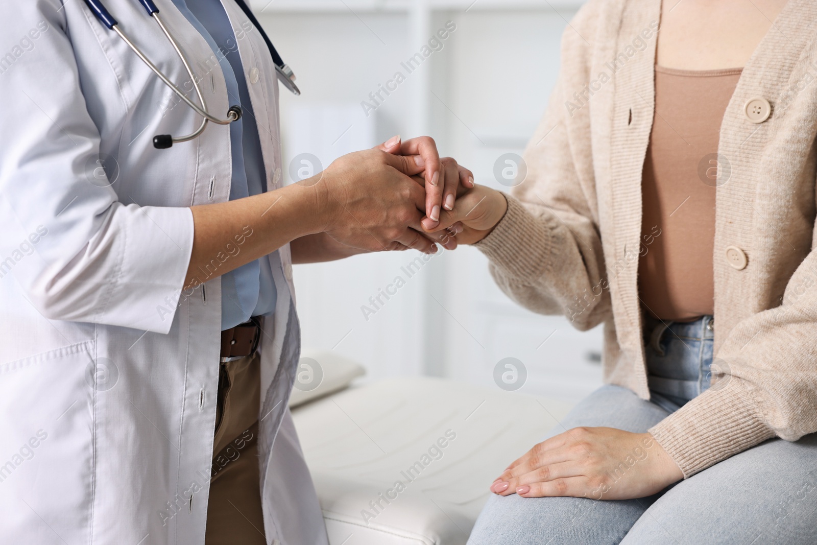 Photo of Professional doctor working with patient in hospital, closeup