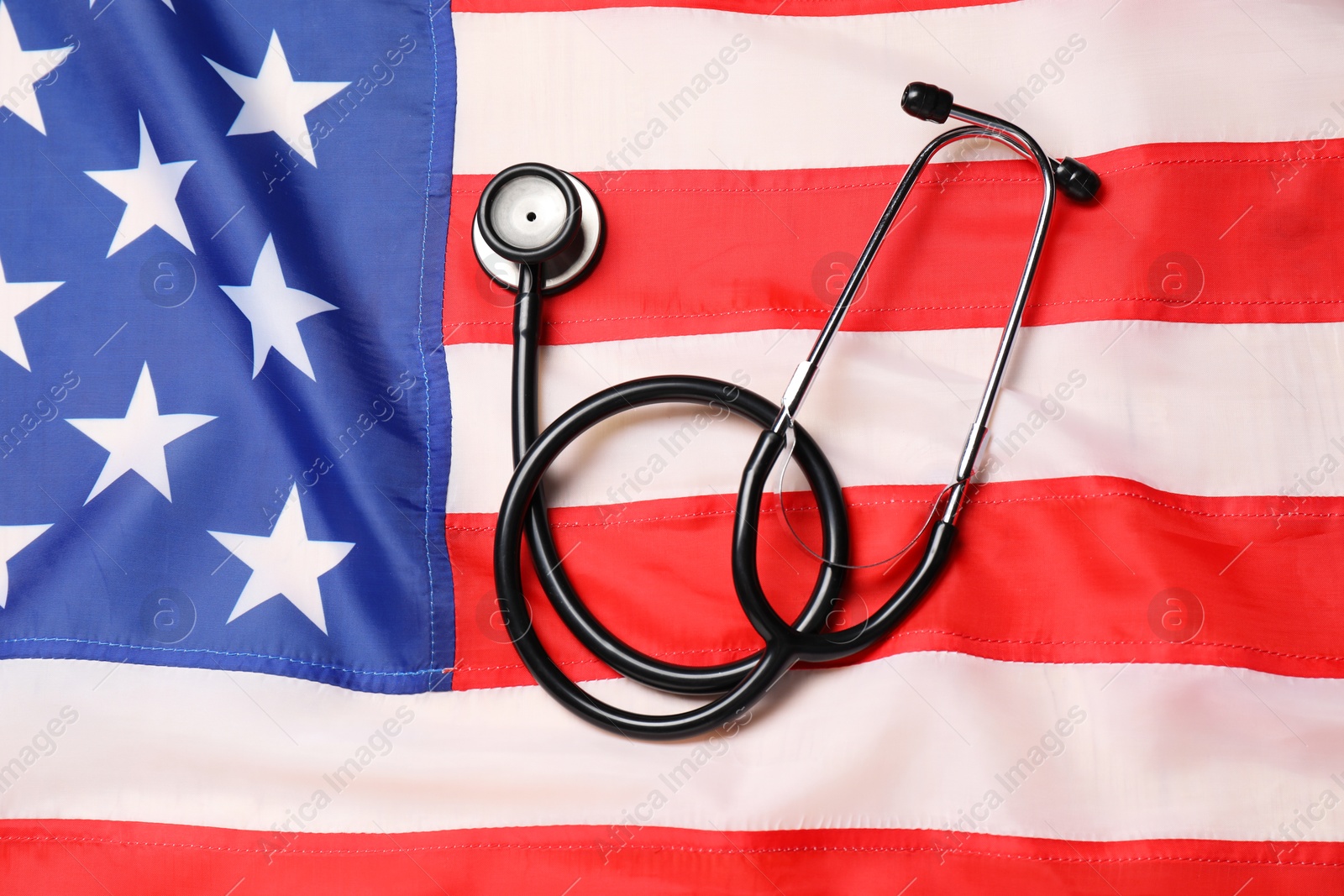 Photo of Stethoscope on USA flag, top view. Health care concept