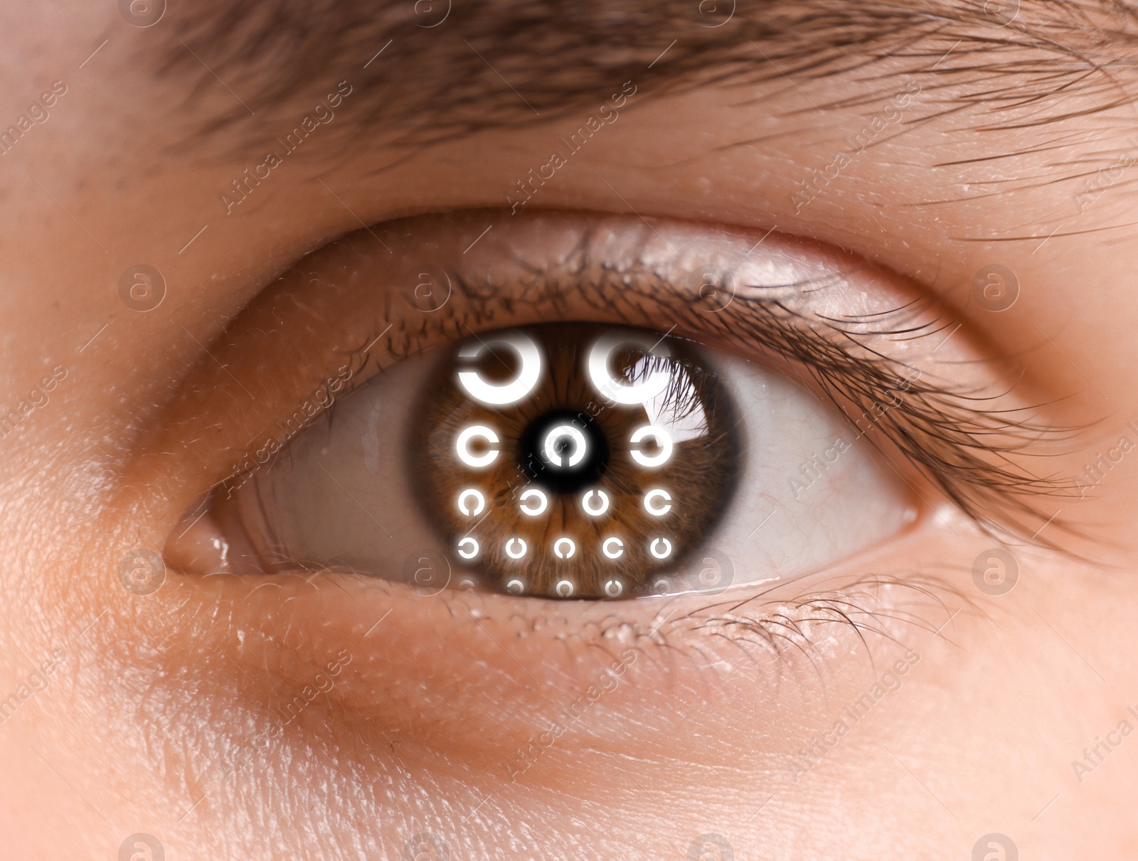 Image of Landolt ring chart in man's eye, closeup. Vision acuity test