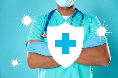 Strong immunity, concept. Doctor and illustration of shield and viruses on light blue background