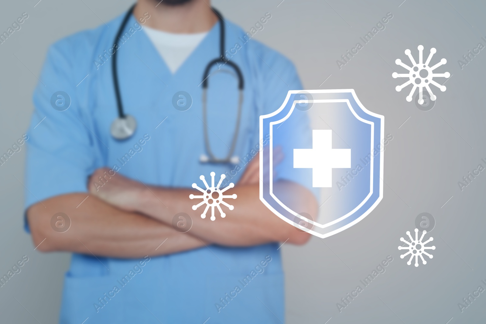 Image of Strong immunity, concept. Doctor and illustration of shield and viruses on grey background