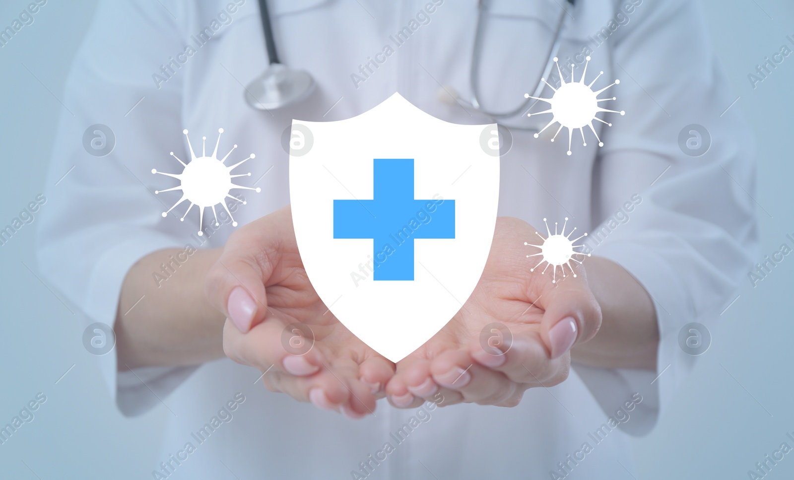 Image of Strong immunity blocking viruses. Doctor holding illustration of shield, closeup