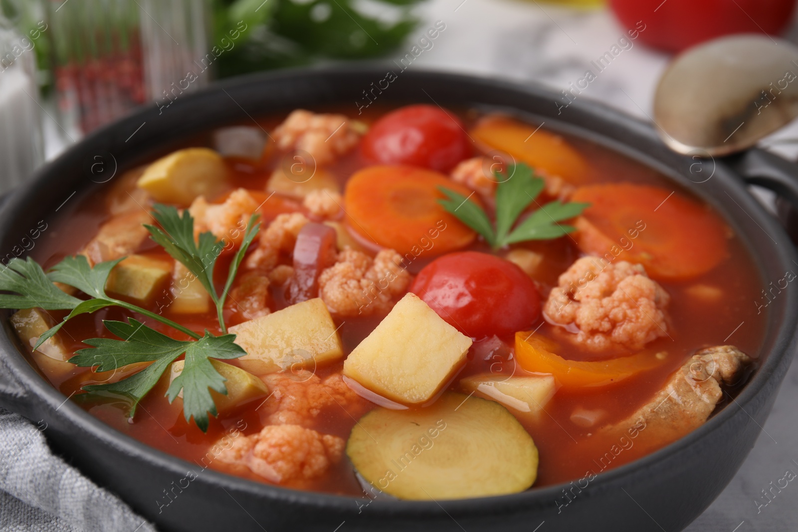 Photo of Tasty homemade stew with vegetables on table, closeup