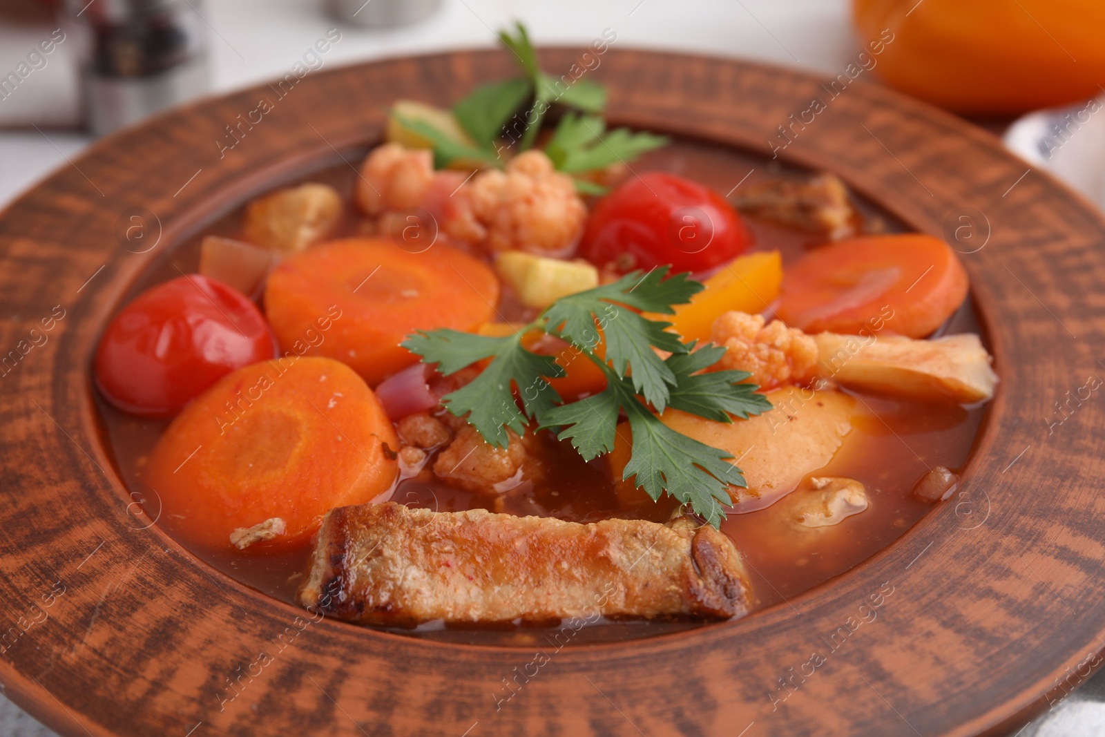 Photo of Tasty homemade stew with vegetables on table, closeup